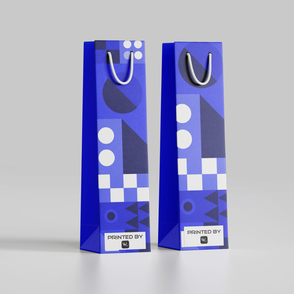 Two strikingly geometric patterned shopping bags in bold blue tones stand side by side, their design a contemporary play of shapes and negative space, representing a modern and artistic approach to retail packaging.